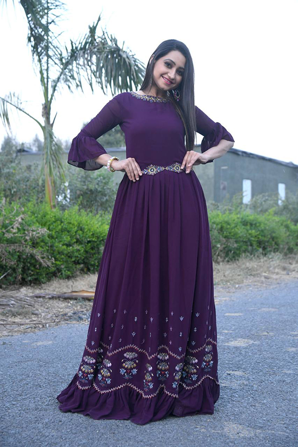 The stylish neck of this embroidered jacket kurta set, paired with a matching Inner santoon fabric bottom, adds a touch of sophistication to this Purple full work Jacket Gown. It is versatile and suitable for various occasions, such as wedding parties and functions, making it a popular choice for partywear.