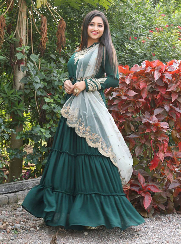 Introducing the stunning Designer Green Embroidered full Sleeves Floral Design Anarkali Gown, the perfect addition to your wardrobe. This gown dress is a masterpiece straight out of Shampysky, made with raw georgette fabric and intricate embroidered Gown, giving it a timeless elegance. With full sleeves and drawstring closure, this gown dress is a comfortable yet stylish choice for any occasion. Stitched tops and full-size gowns are available, allowing for easy customization and a perfect fit.