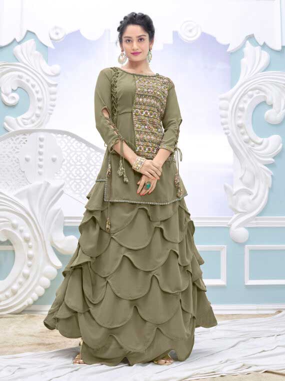 Introducing the Designer Olive Green Flared Embroidered Lehenga Suit, with beautiful floral work that will leave you feeling like a queen. This stunning outfit is fabricated in raw georgette with intricate embroidered borderwork. It is designed with 3-4 sleeves and a drawstring closure, ensuring comfort and ease of wear. The fully stitched lehenga is the perfect fit for you, and you will undoubtedly impress others at weddings, parties, and functions with this beautiful attire. The stylish neck with a flared kurta lehenga set comes with a matching inner santoon fabric bottom, making it a popular choice for Partywear.