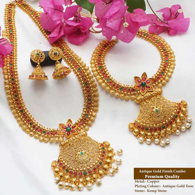 This haram set has a unique design that ties it to its true Indian roots. It has the glorious shine of kempu stone and the special Bandhai stone that come together beautifully with the antique plating.

Stand out from the crowd whenever you wear it, everywhere you wear it. Its unique design and a beautiful structure make it extra special. Its a must-have in every jewel box.

Product Details
The total length of the Short necklace is 8 Inches (4 inches on both sides).
The total length of the long necklace is 18 Inches (9 inches on both sides).
The height of the earrings is  2.5 cm and the width is  1.5 cm.
Necklace back site adjustable rope is attached.
Earrings lock is a press type.
100% made with love in India
We manufacture, design, and sell all of our jewelry