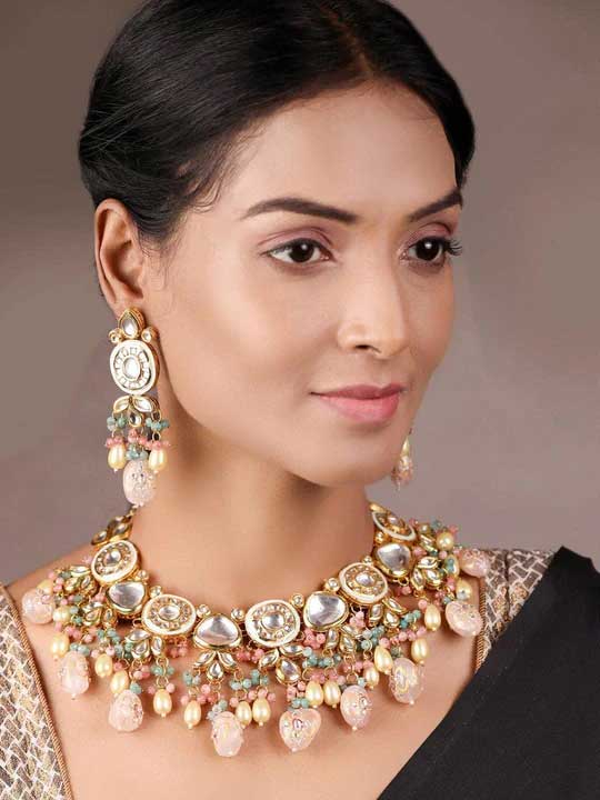 A little touch of some gems, pearls and stones can make your ethnic outfit more beautiful and elegant in the most traditionally desired way.

This gorgeous necklace and set with the perfect matching earrings are the glittery glamour that will make you feel special.