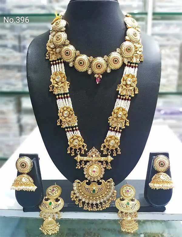 Contains : 1 Long Necklace + 1 Choker Necklace + 2 Pair of Earrings
Traditional Temple Gold Finish long haram Necklace Set for Women will complement any Indian attire. Women Love Jewelry as it not only enhances their beauty, but also gives them the social confidence. Make your moment memorable with this range.
